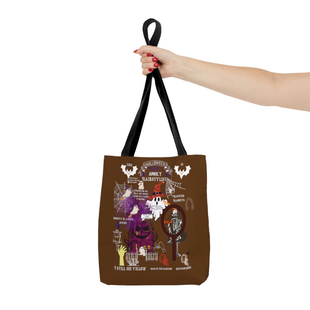 A hand holding up a brown bag with an image of a person.