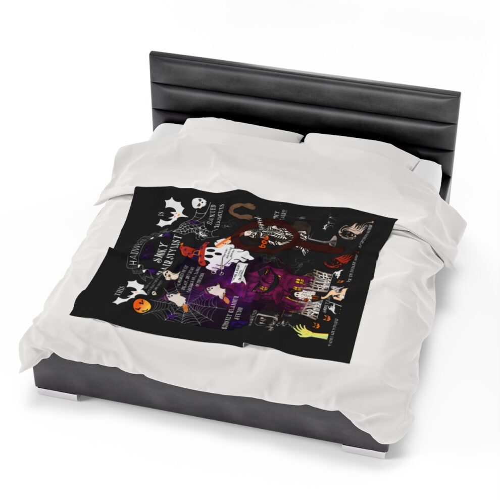A bed with white sheets and black covers