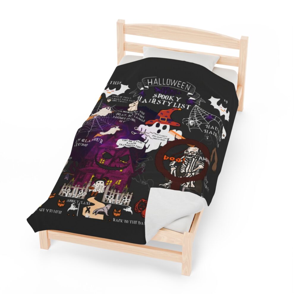 A bed with a black cover and wooden frame