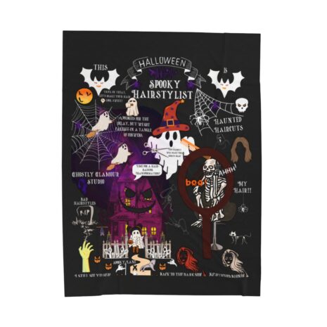 A black blanket with various halloween images on it.