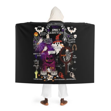 A person wearing a hooded blanket with a picture of the joker.