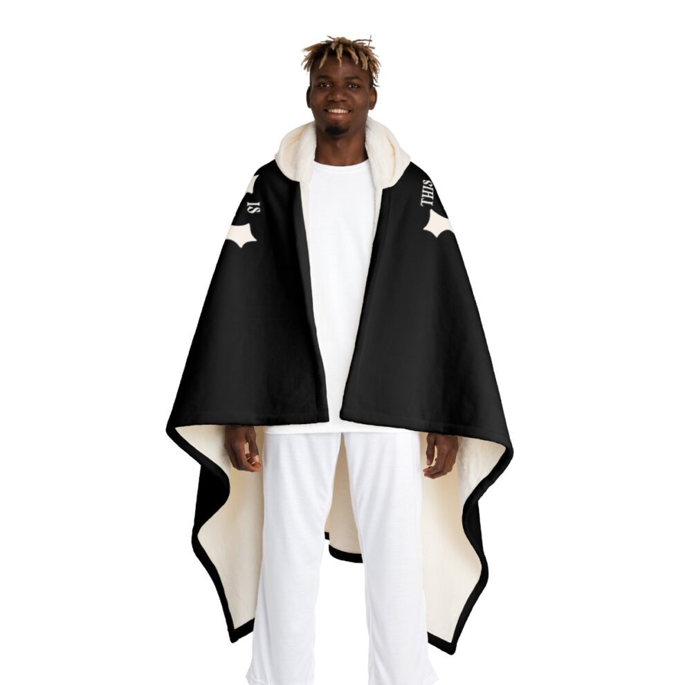 A man wearing a black and white cape.