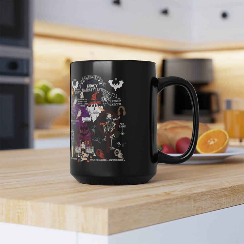 A black coffee mug sitting on top of a counter.