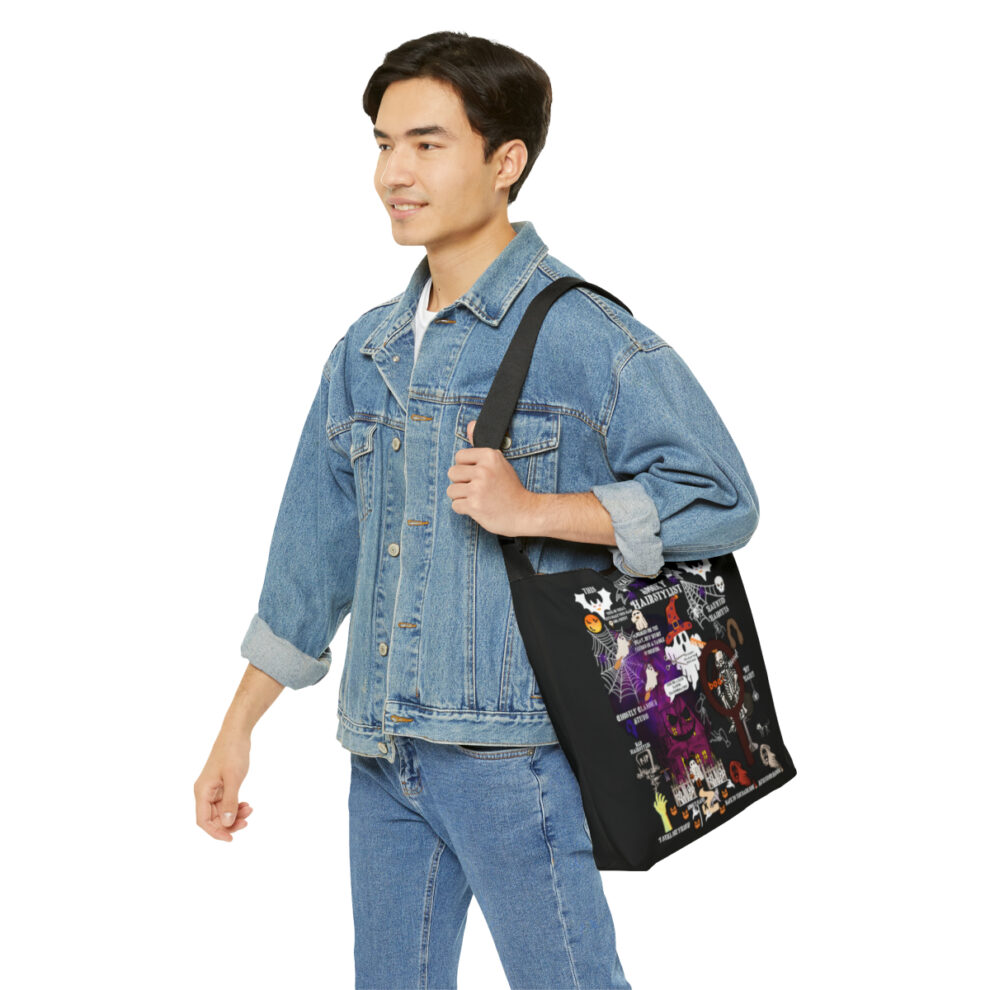 A man in denim jacket holding a bag.