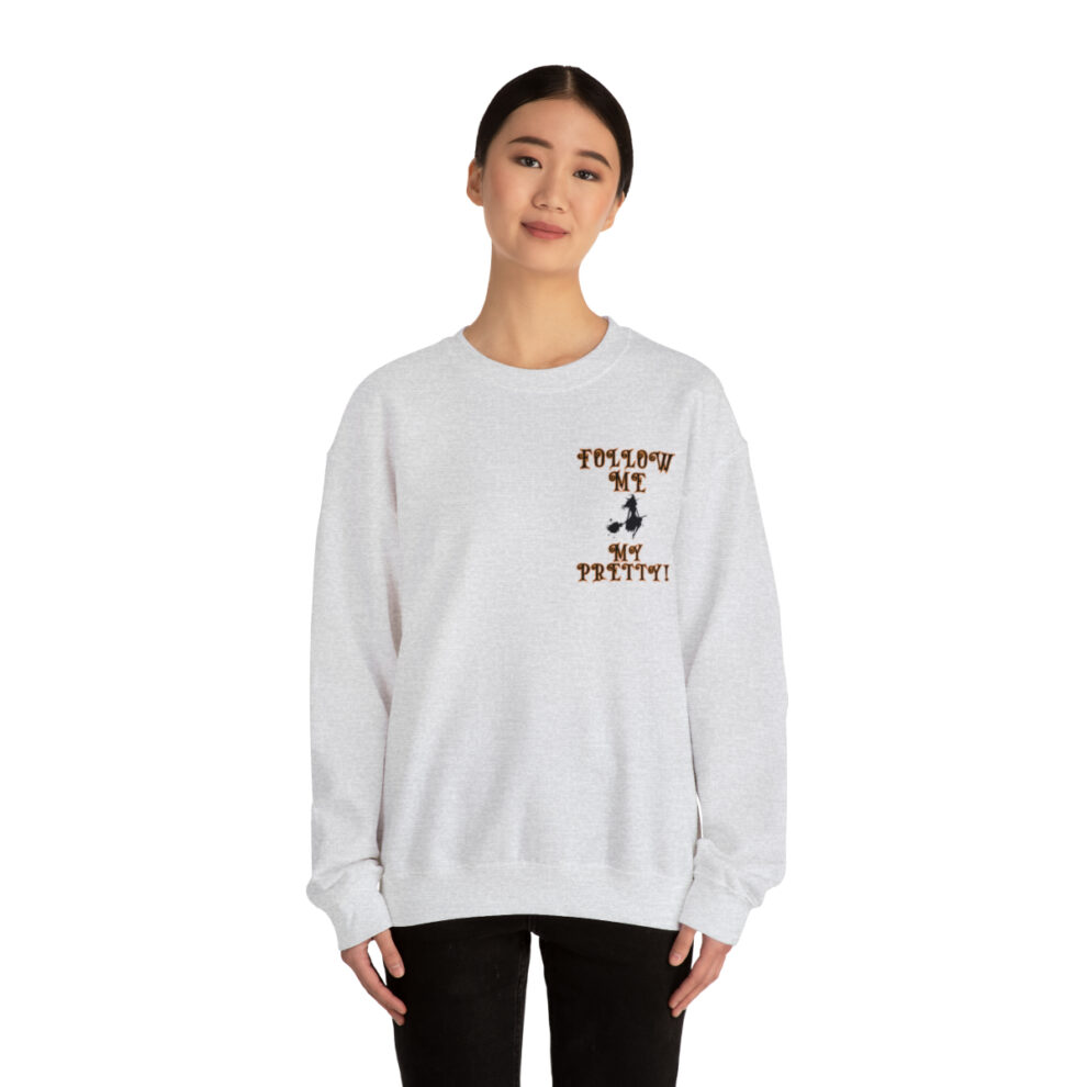 A woman wearing a white sweatshirt with a brown and black design.