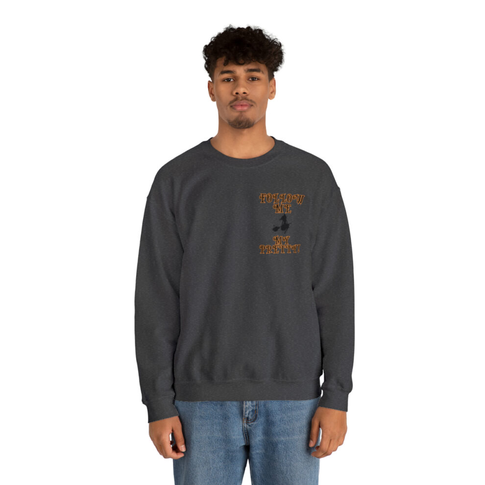 A man wearing a sweatshirt with an image of a person on it.
