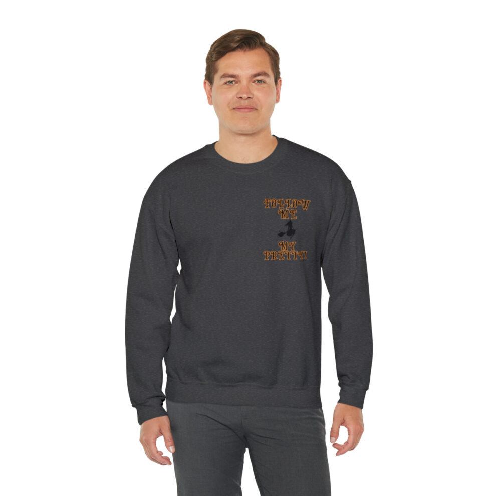 A man wearing a black sweatshirt with an orange logo.