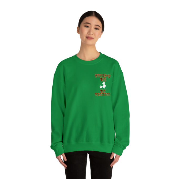 A woman in green sweatshirt with a bird on the front.