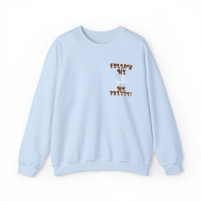 A light blue sweatshirt with the words " trippin ' on me " and " no restful !" printed in brown lettering.