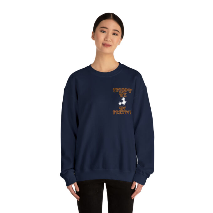 A woman wearing a sweatshirt with an image of a person on it.