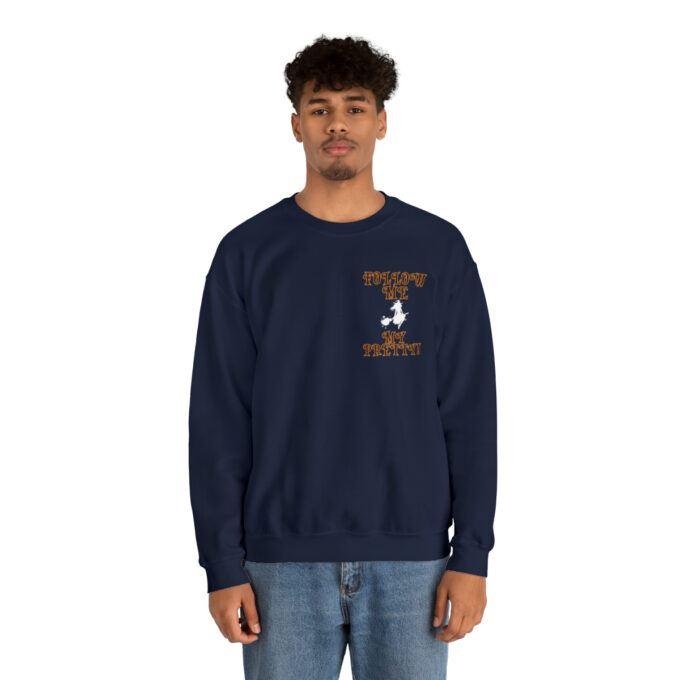 A man in a navy blue sweatshirt with an image of a person on it.