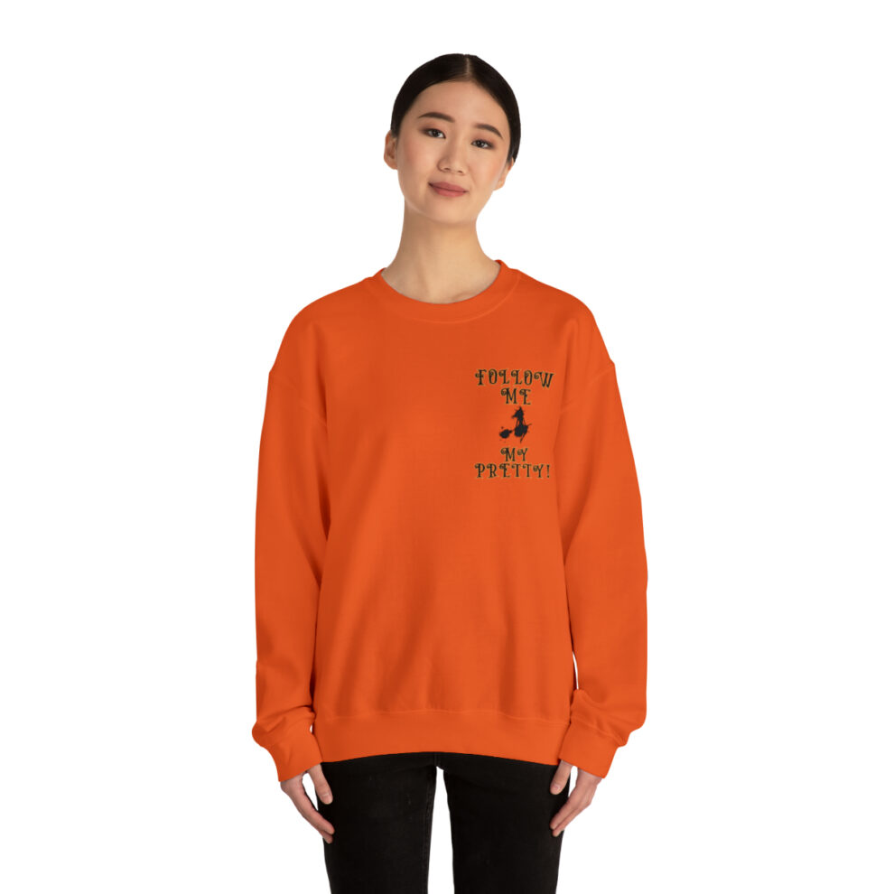 A woman wearing an orange sweatshirt with the words " nothing but faith."