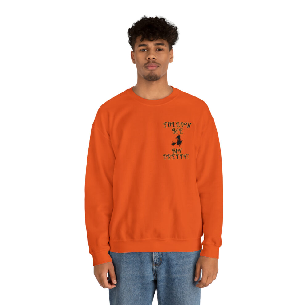 A man in an orange sweatshirt with a black and white logo.