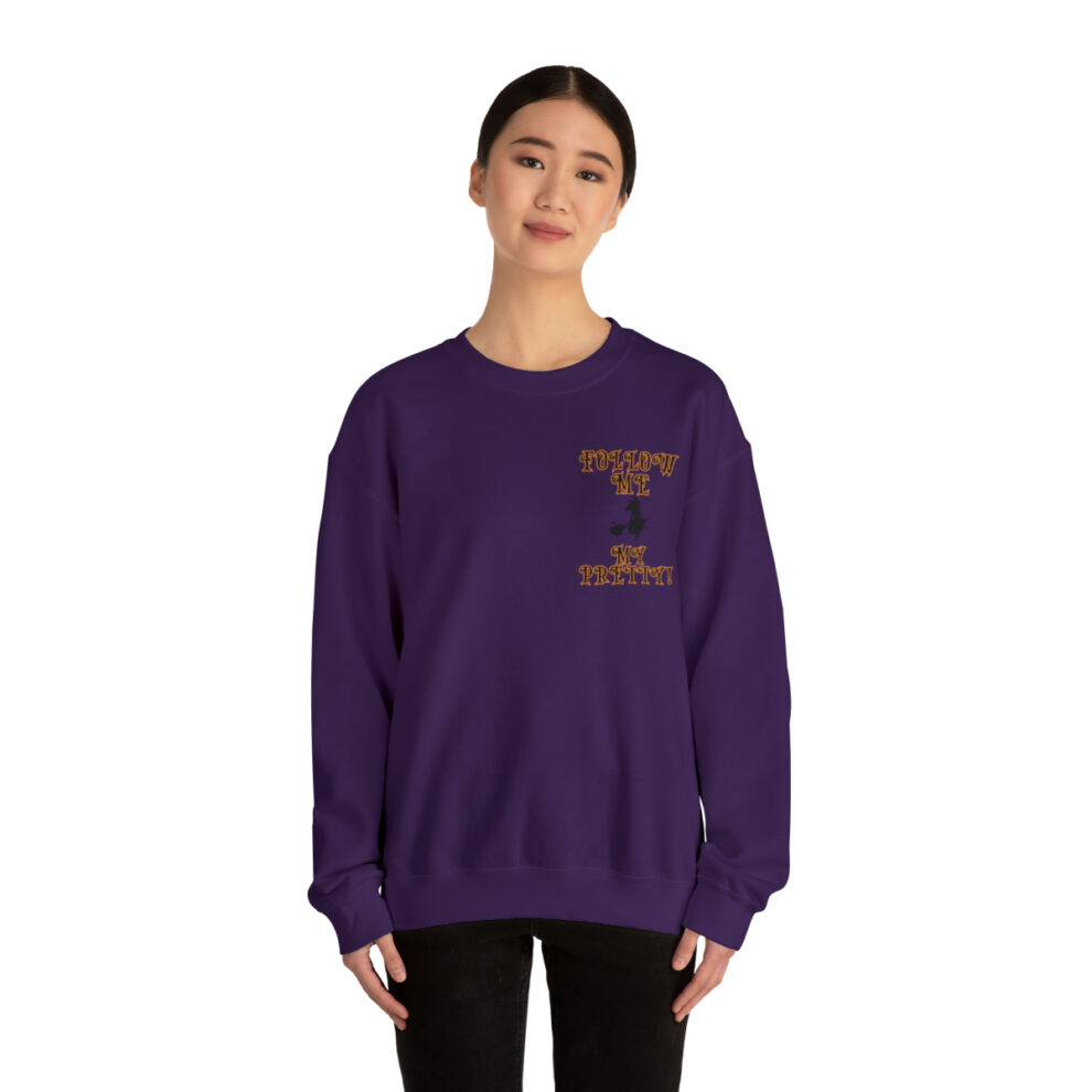 A woman wearing a purple sweatshirt with the letter i on it.