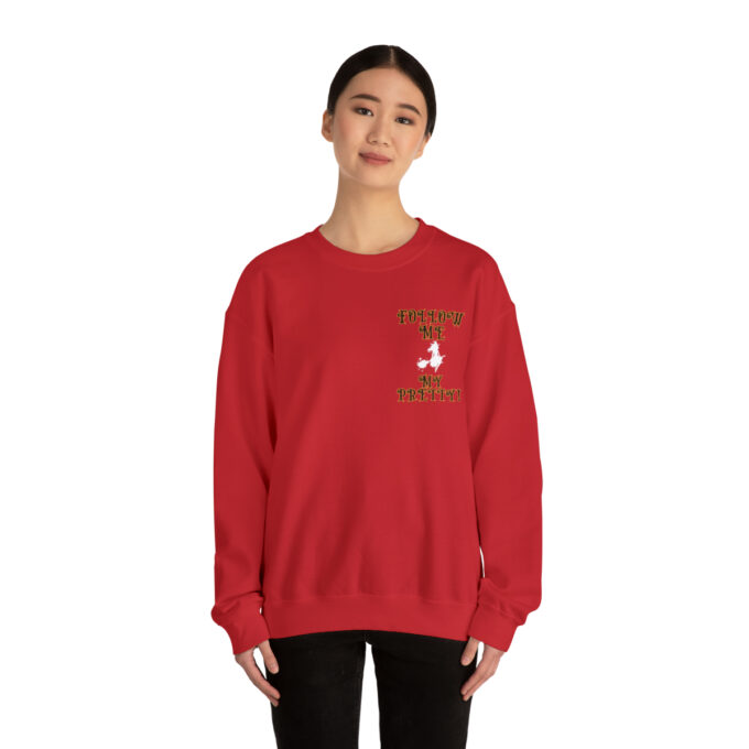 A woman in red sweatshirt with a bird on the front.