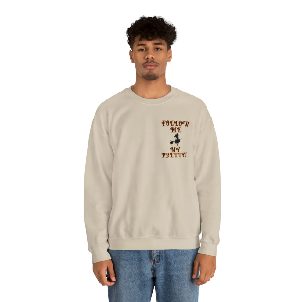A man in a white sweatshirt with a brown bird on it.
