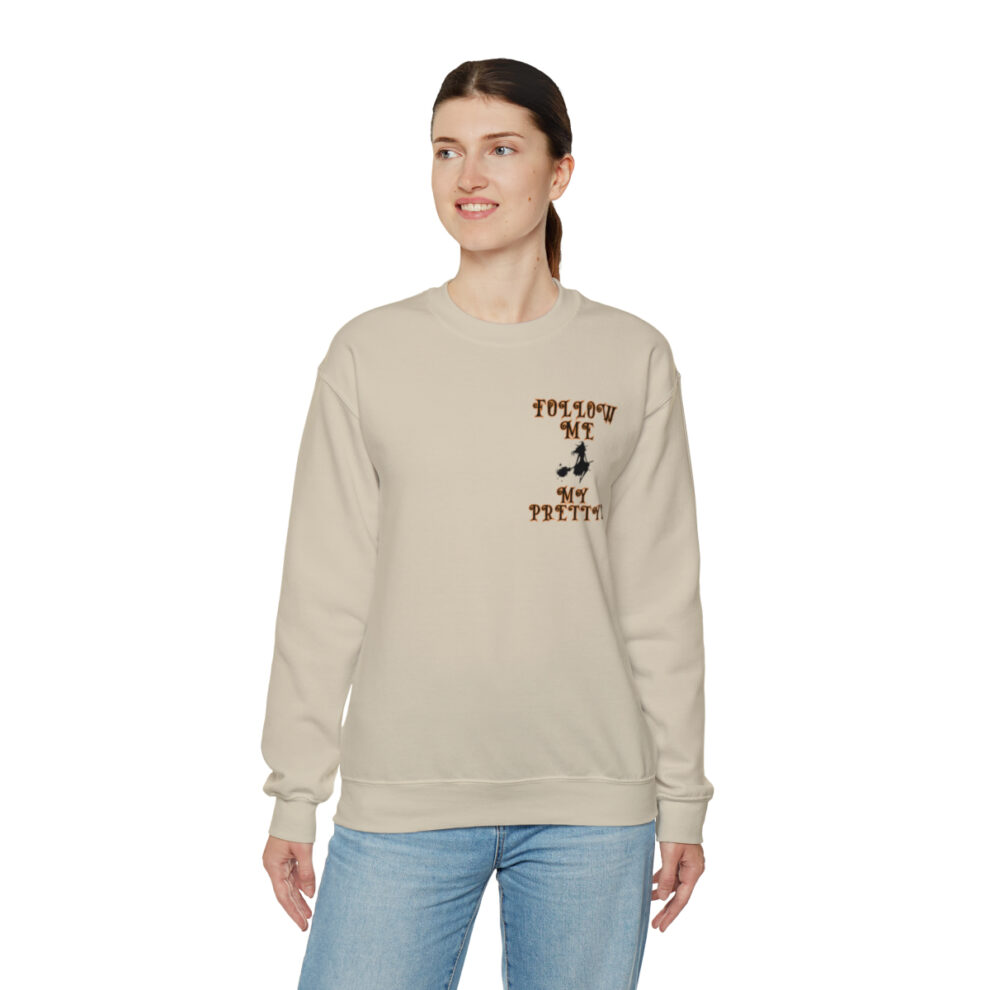 A woman wearing jeans and a sweatshirt.