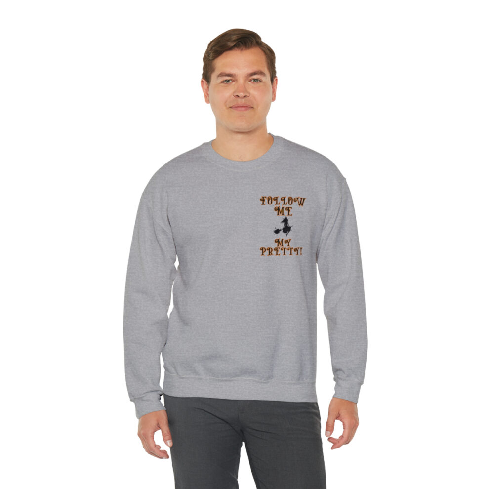 A man wearing a gray sweatshirt with an image of a person.