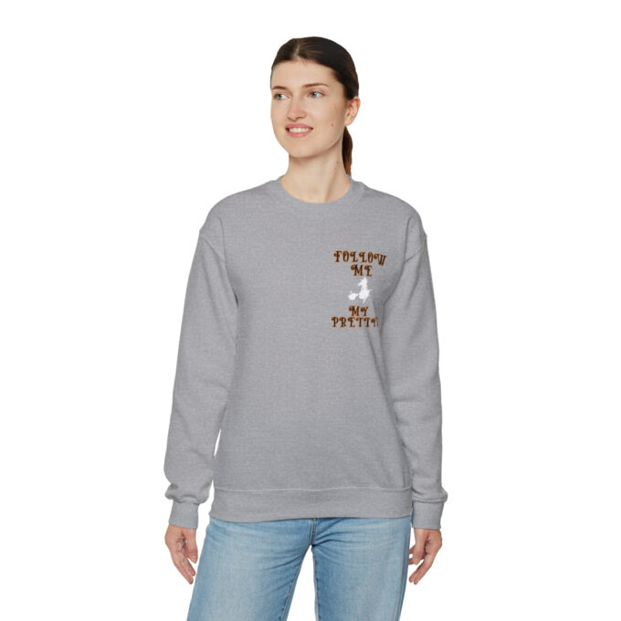 A woman wearing jeans and a sweatshirt.