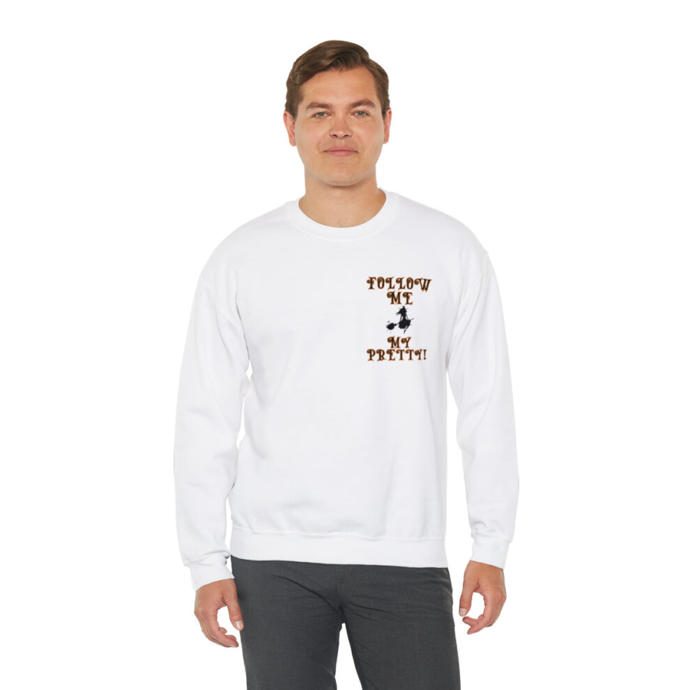 A man wearing a white sweatshirt with an image of a person.