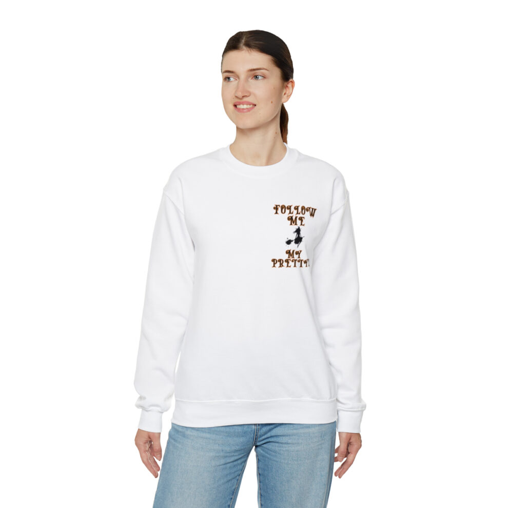 A woman wearing a white sweatshirt with a brown and black design.