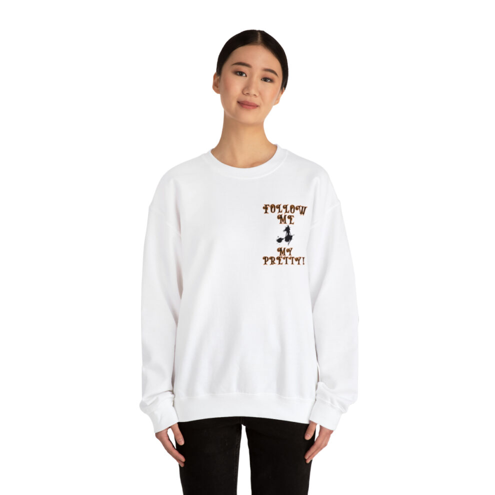 A woman wearing a white sweatshirt with a picture of a person.
