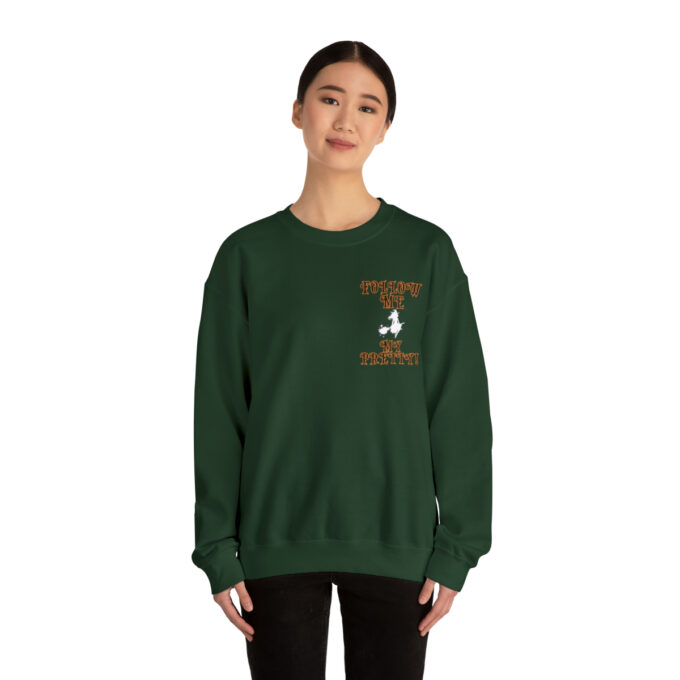 A woman wearing a green sweatshirt with an eagle on the front.
