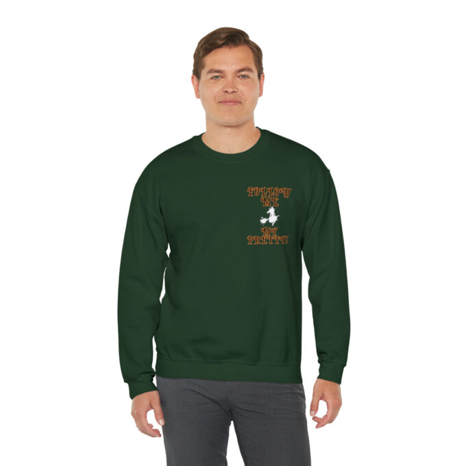 A man wearing a green sweatshirt with an image of a bird.