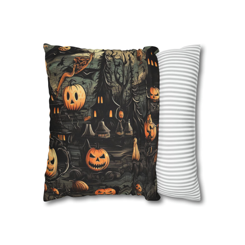 A pillow with a picture of pumpkins and bats.