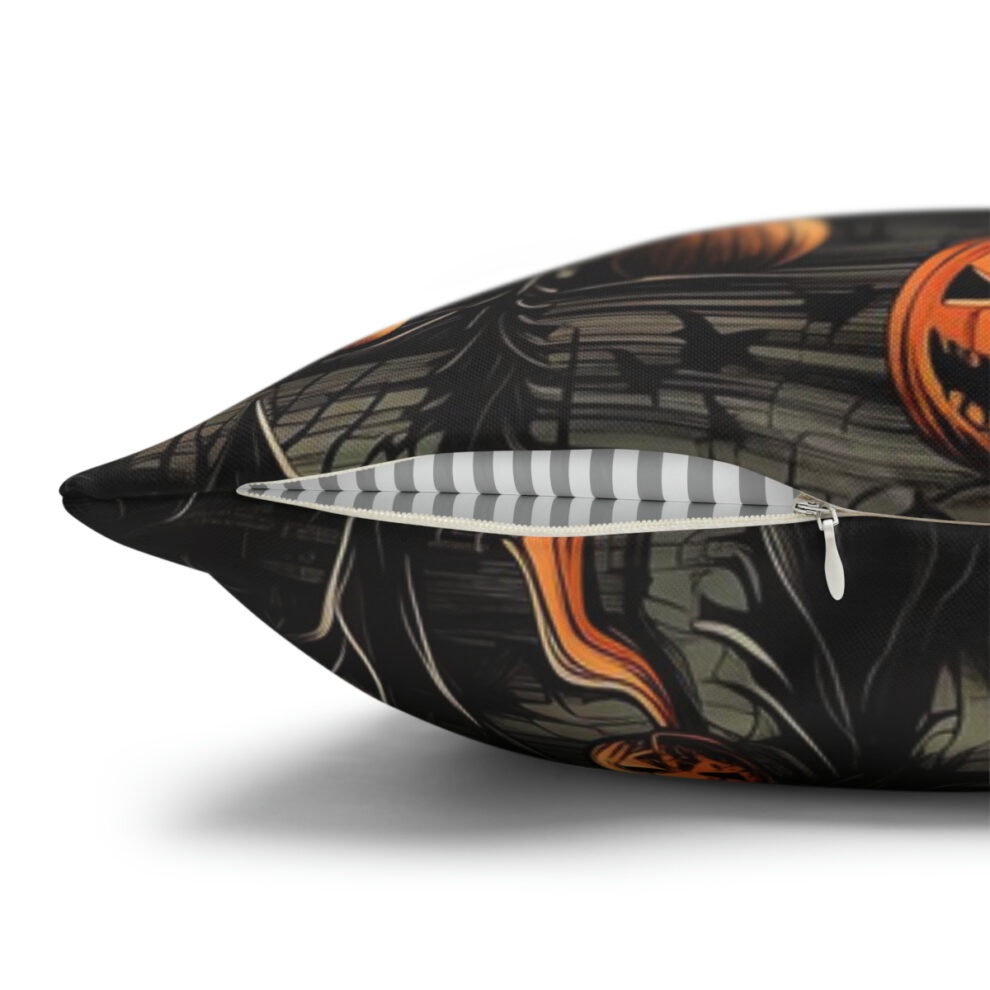 A pillow with a picture of pumpkins and bats.