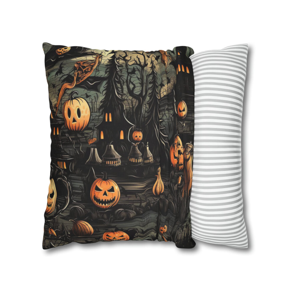 A pillow with a picture of pumpkins and trees.