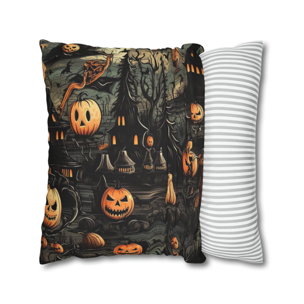 A pillow with pumpkins and bats on it