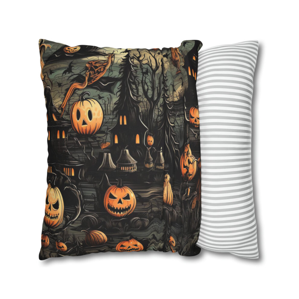 A pillow with pumpkins and bats on it