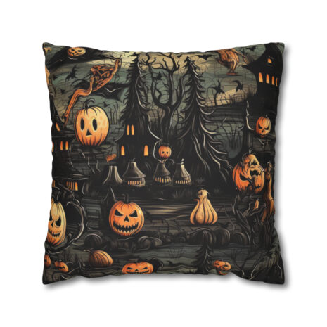 A pillow with pumpkins and trees on it.
