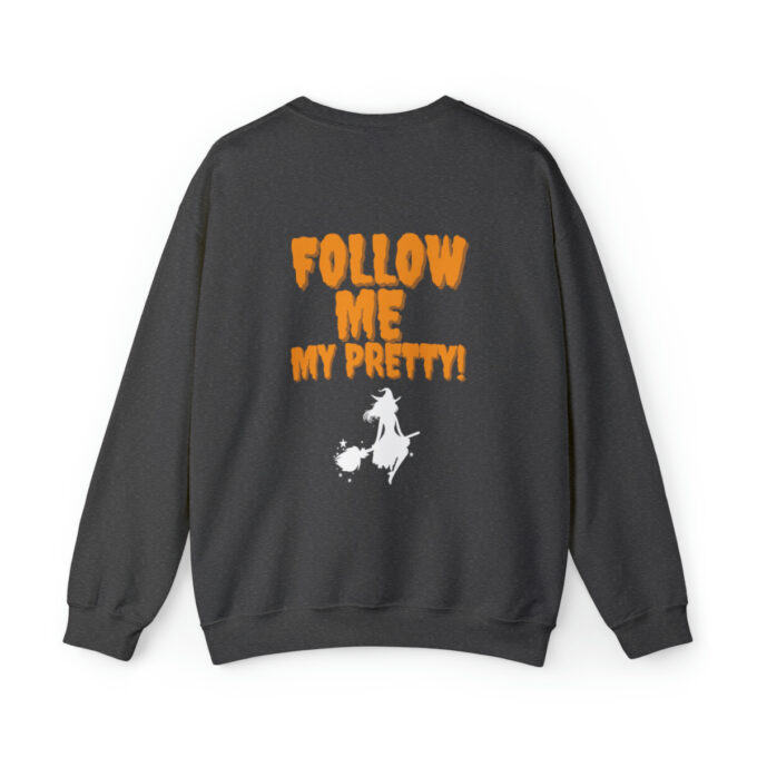 A black sweatshirt with the words " follow me my pretty !" on it.