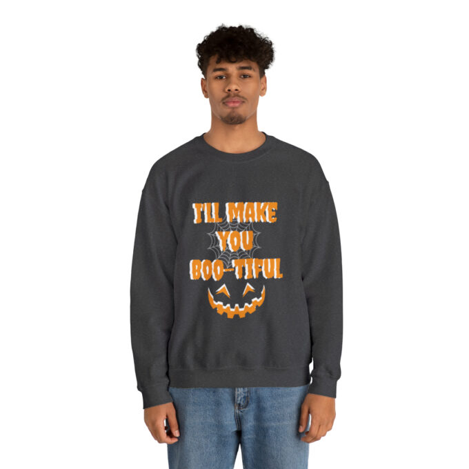 A man wearing an i 'll make you boo-tiful sweatshirt.