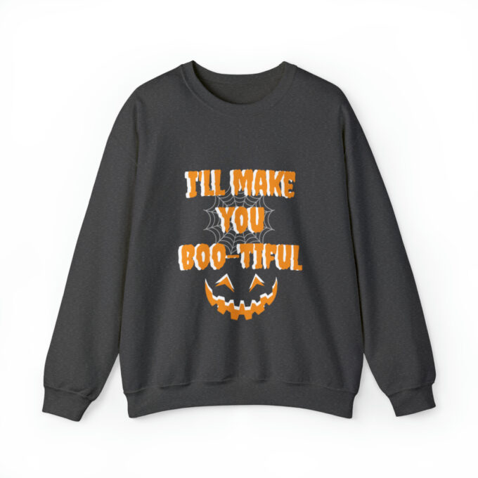 A black sweatshirt with an orange and white pumpkin on it.