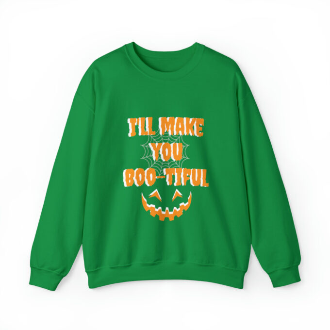 A green sweatshirt with an orange and yellow pumpkin.