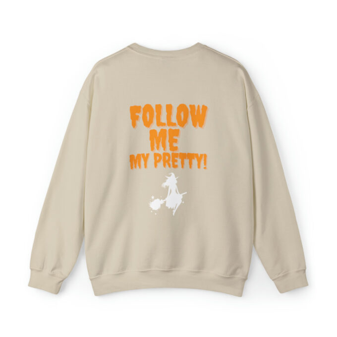 A beige sweatshirt with the words " follow me my pretty !" on it.