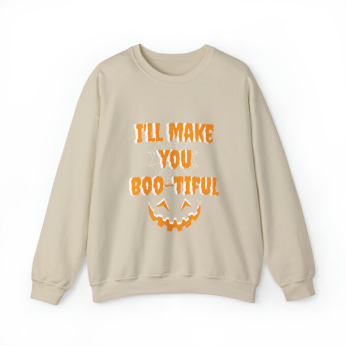 A beige sweatshirt with an orange lettering that says " i 'll make you boo-tiful ".