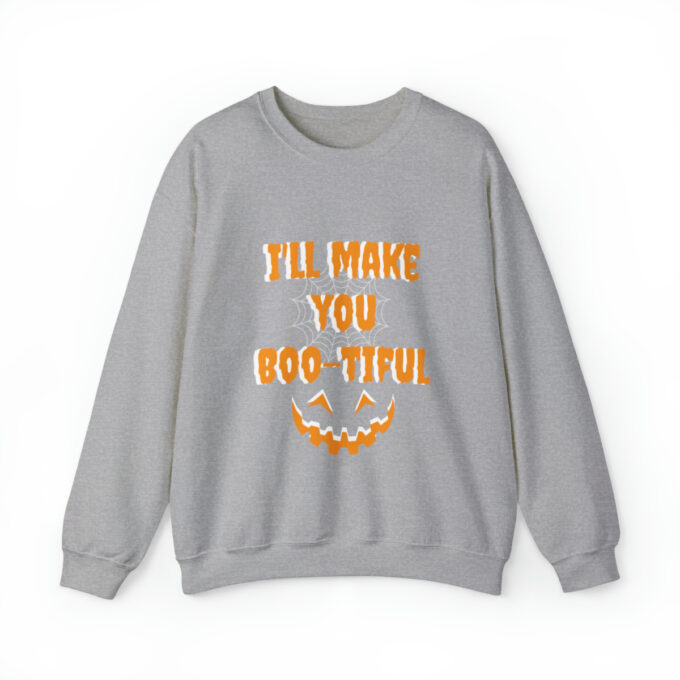 A gray sweatshirt with an orange and white pumpkin on it.