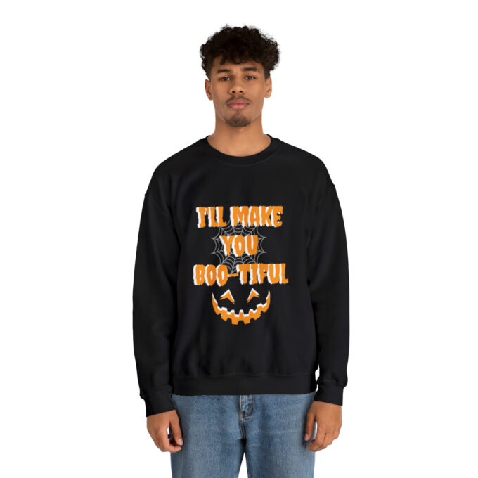A man wearing an i 'll make you boo-tiful sweatshirt.