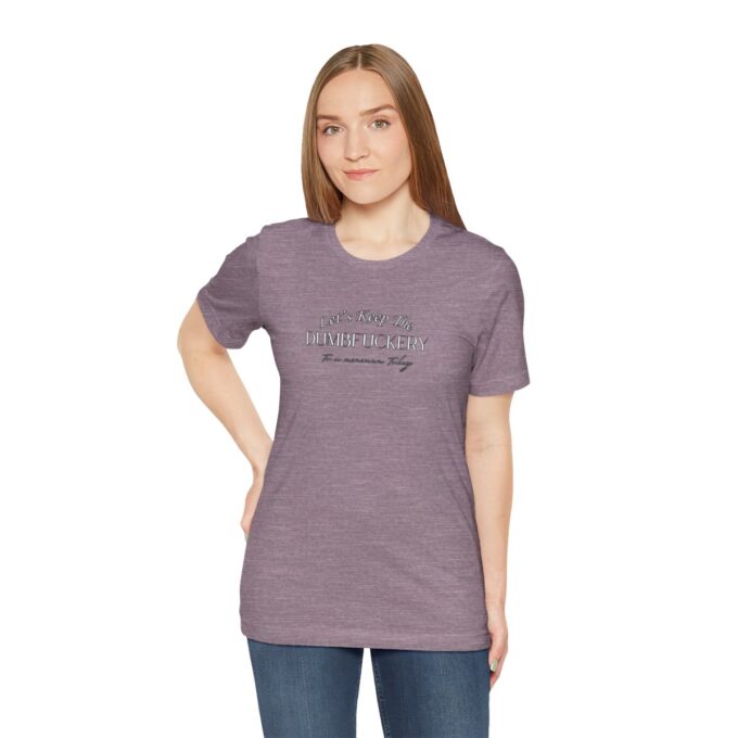 A woman wearing a purple t-shirt with the words " everything is possible ".
