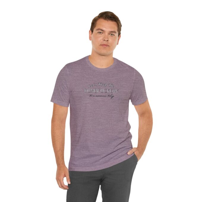 A man wearing a purple shirt and black pants.
