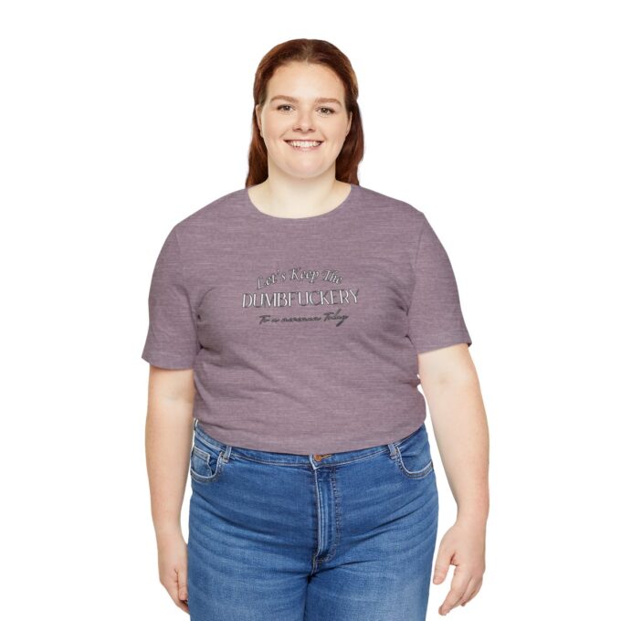 A woman wearing jeans and a t-shirt with the words " i am not fat. It is just me."