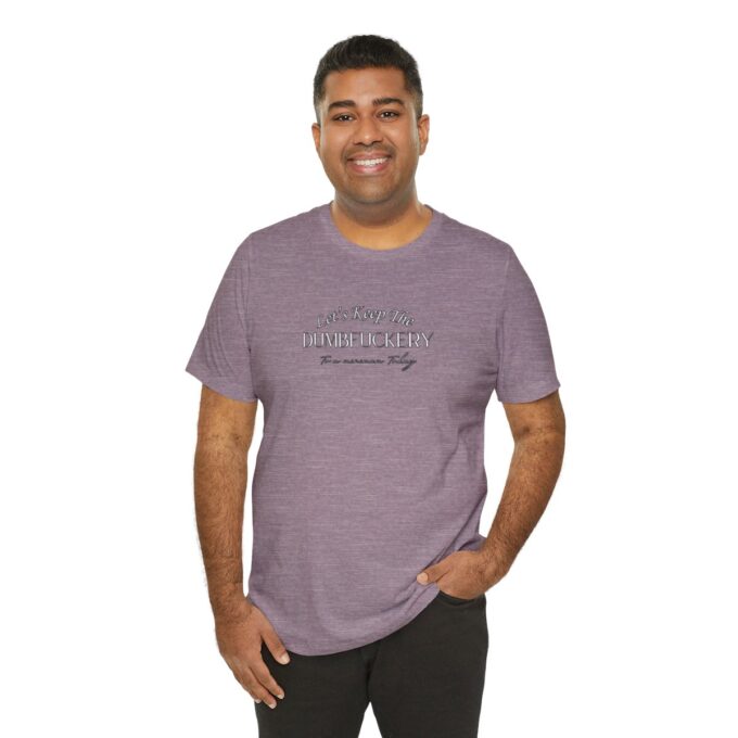 A man wearing a purple shirt and black pants.