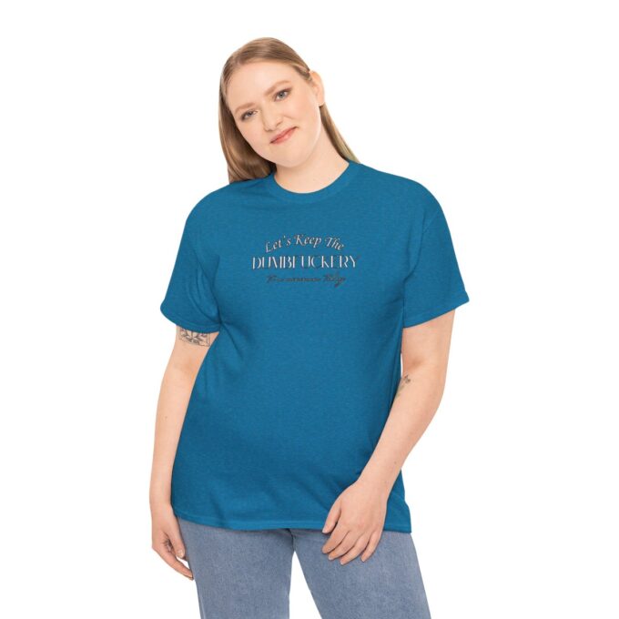 A woman wearing a blue t-shirt with the words " nothing is impossible."