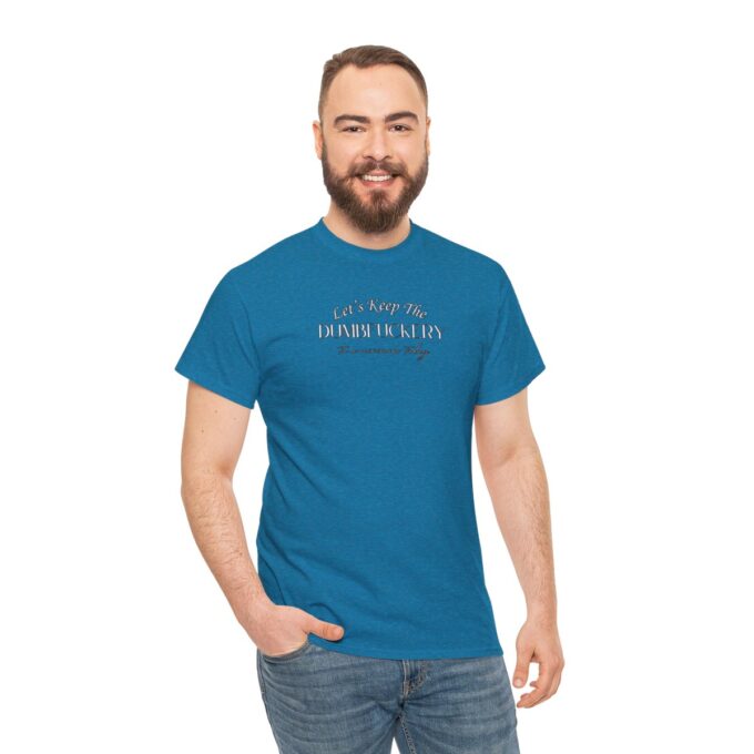 A man with beard and jeans wearing a blue t-shirt.