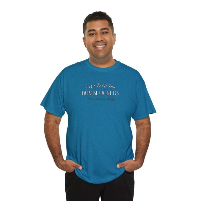 A man wearing a blue t-shirt with the words " i am proud of how far we 've come ".