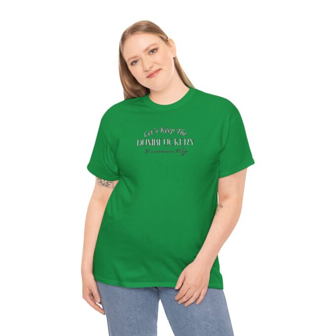 A woman wearing a green shirt and jeans.